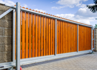 rolling gate with wood inlay