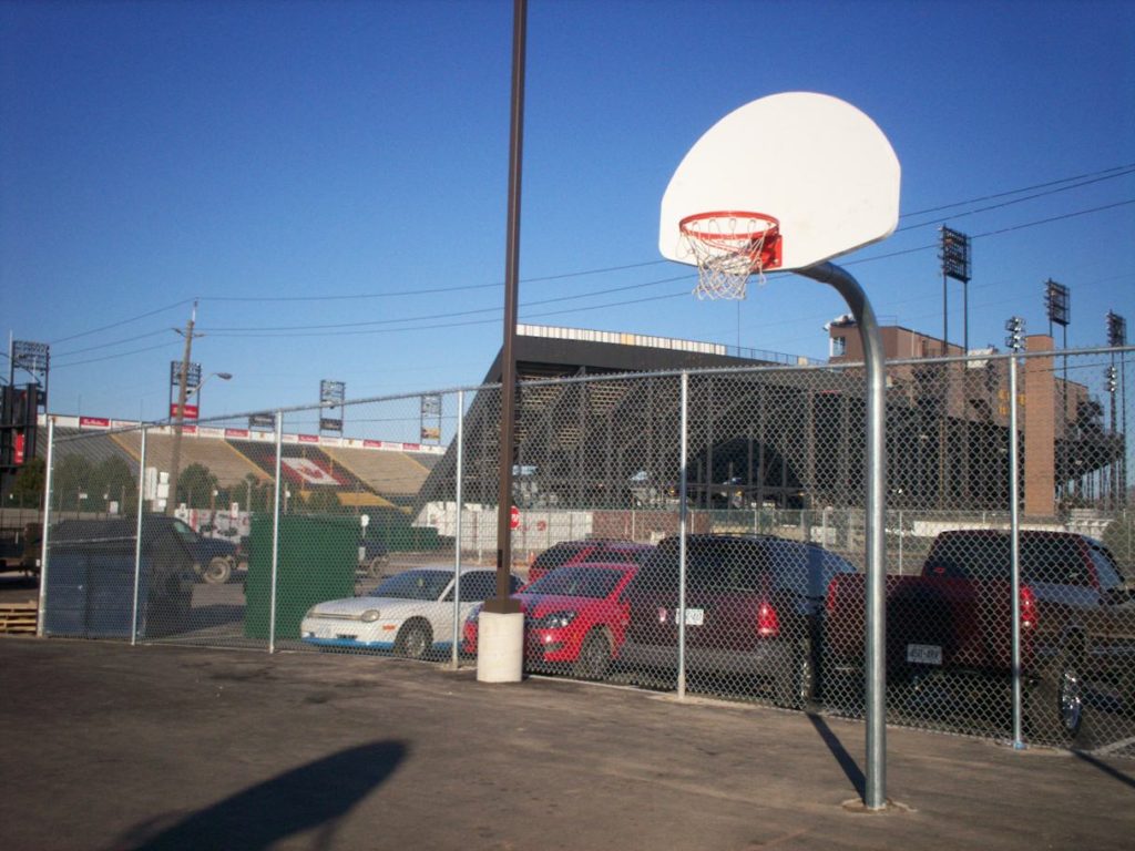 basketball posts and chain link fence